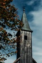 Black church bell tower, ominous in the background Royalty Free Stock Photo