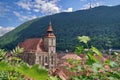 Landmark attraction in Brasov, Romania. Old town. The catholic Black Church (Biserica Neagra) and Tampa mountains