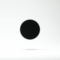 A black circle is centered on a plain white background, creating a minimalist and Royalty Free Stock Photo