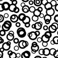 Black circle seamless pattern with intersecting hand drawn thick and thin outline rings. Vector chaotic monochrome Royalty Free Stock Photo