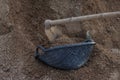 Black clam-shell shaped basket used for transporting soil in the contruction site. Royalty Free Stock Photo