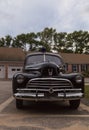 Black classic Chevrolet Special Deluxe police car