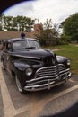 Black classic Chevrolet Special Deluxe police car