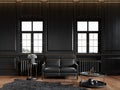 Black classic loft interior with wall panels, leather sofa, carpet and decor. Royalty Free Stock Photo