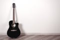 Black Classical Acoustic Guitar in an Empty Room with Copy Space