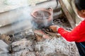 Black clay pot on the stove Royalty Free Stock Photo