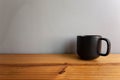 The black clear set of dishes on wood table and gray walls