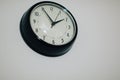 Black clock hanging on wall Royalty Free Stock Photo