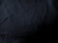 Black cloth texture background. Tangled viscose fabric surface