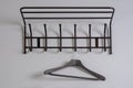 Black clothes hanger on a gray wall background Royalty Free Stock Photo