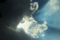 Black Cloud Background Photo With Sunlight Penetrating The Clouds