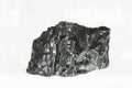 Black coal mine close-up with large depth of field. Anthracite coal bar isolated on white background Royalty Free Stock Photo