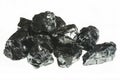 Black coal mine close-up with large depth of field. Anthracite coal bar isolated on white background Royalty Free Stock Photo