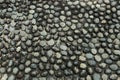 Black cobbled stone road background