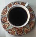 Black coffe indoesian flavour with batik glasses Royalty Free Stock Photo