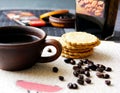 Black coffee beans and biscuits and chocolate