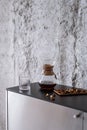 Black coffee brewing in glass chemex on countertop at kitchen Royalty Free Stock Photo