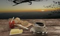 Black coffee in clear glass and Home made bread on butcher for breakfast concept on wooden table. Background blur mountian