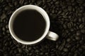 Black Coffee in a cup on the background of coffee Royalty Free Stock Photo