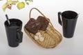 Black coffee cup, chocolate muffins and yellow orchid Royalty Free Stock Photo