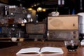 Black coffee cup and wooden desk diary