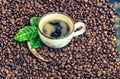 Black coffee drink green leaves coffee beans background vintage Royalty Free Stock Photo