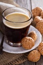 Black coffee in a glass with almond cookies Royalty Free Stock Photo