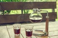 Black coffee in glass and coffee jar Royalty Free Stock Photo