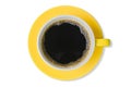 black coffee with heart-shaped froth in the yellow coffee cup isolated on white background top view Royalty Free Stock Photo