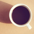 Black coffee with light and shadow, retro filter Royalty Free Stock Photo