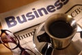 Black Coffee, Newspaper and Glasses Royalty Free Stock Photo