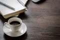 Black coffee on the office desk table with computer, silver pen. Royalty Free Stock Photo