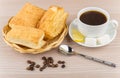 Black coffee, pieces of lemon and sugar, flaky biscuits Royalty Free Stock Photo