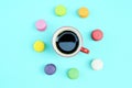 Black coffee red cups and colorful macaroons sweet and dessert food concept backgrounds above Royalty Free Stock Photo