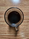 Black coffee, is the result of direct extraction from boiling coffee beans served without the addition of any flavoring.