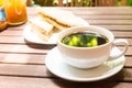 Black coffee served outdoor with wholemeal sandwich bread at the background Royalty Free Stock Photo