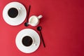 black coffee in small coffee cup and milk jug on red background Royalty Free Stock Photo