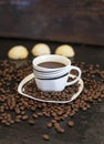 Black coffee and spilled coffee beans decorated Royalty Free Stock Photo