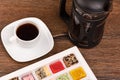 Black coffee and Turkish delight in a box on a wooden table Royalty Free Stock Photo