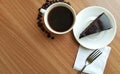 black coffee white cup chocolate cake wood table Royalty Free Stock Photo