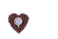 Black coffee in a white cup Placed in roasted coffee beans The pile is heart-shaped On a white background Royalty Free Stock Photo