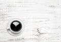 Black coffee on wooden background. Kitchen table surface