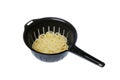 Black colander filled with spaghetti