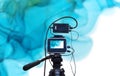 black color camera, camera taking live video streaming, technology live streaming and broadcast concept, watercolor texture