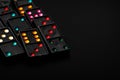 Black color dominoes with colorful dot game pieces Royalty Free Stock Photo