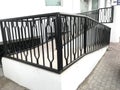 Black color enamel oil painted over the surface of galvanized iron or mild steel handrail or balustrade for an entrance for an