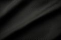 Black color football jersey clothing fabric texture sports wear background, close up