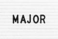 Black letter in word major on white felt board background