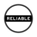 Black round seal sticker in word reliable on white background