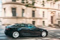Black Color Tesla Model S 100d Car Fast Drive In Summer City Street. The Tesla Model S Is A Full-sized All-electric Five Royalty Free Stock Photo